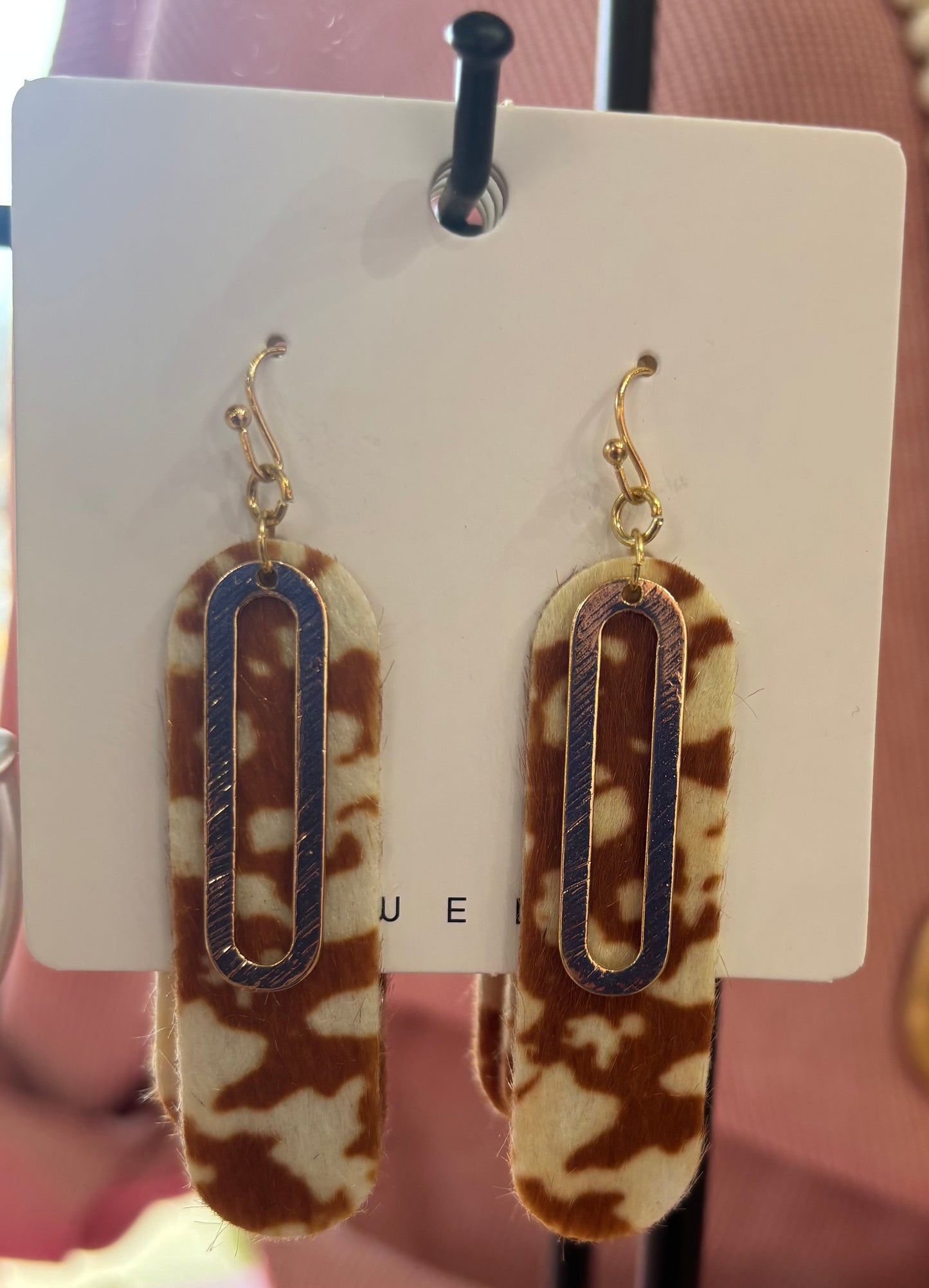 Cow print dangly earrings
